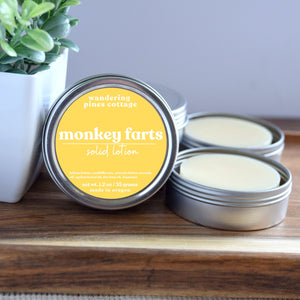 Monkey Farts Solid Lotion in a tin