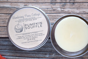 Solid lotion in a tin pumpkin scent - wandering pines cottage